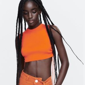 This is an orange Side Cut Out Knit Top. Size- medium